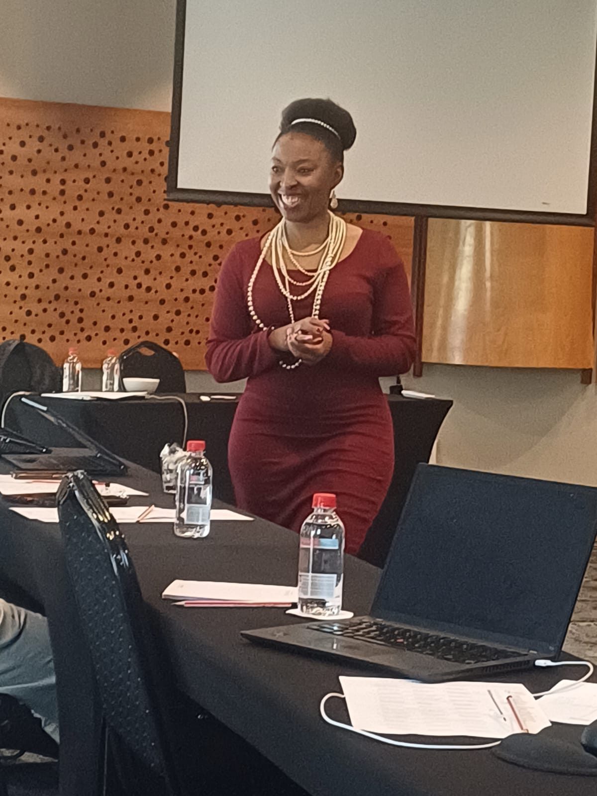 Lerato Senoko Dube facilitating a workplace session in a conference room